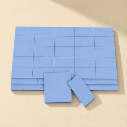 Heatguard – Blue silicone sheet scored into a grid of small rectangles, with two pieces separated in front