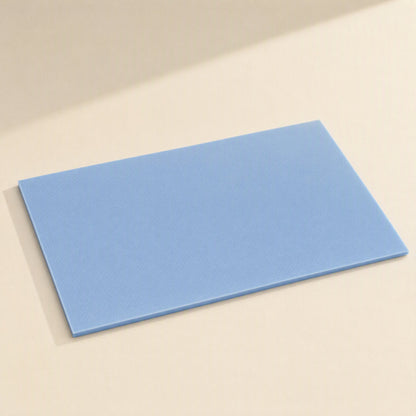 Heatguard High Temperature Silicone Sheet – single blue silicone sheet lying flat at an angle on a cream surface