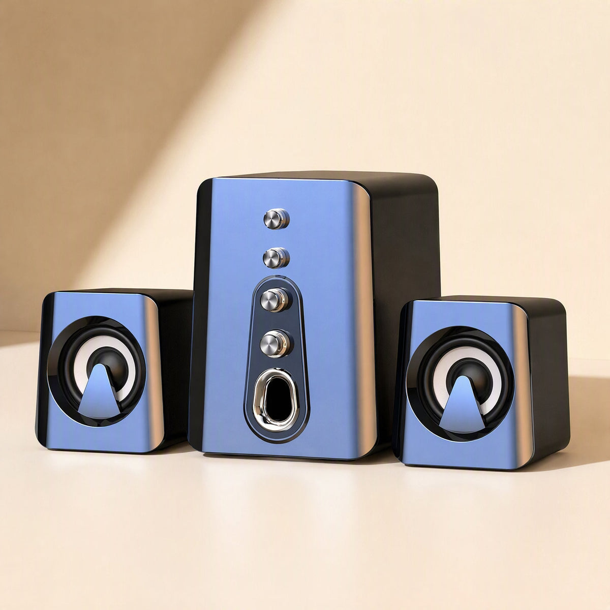 Deskchime small speaker set in blue and black: a subwoofer between two satellite speakers on a cream surface