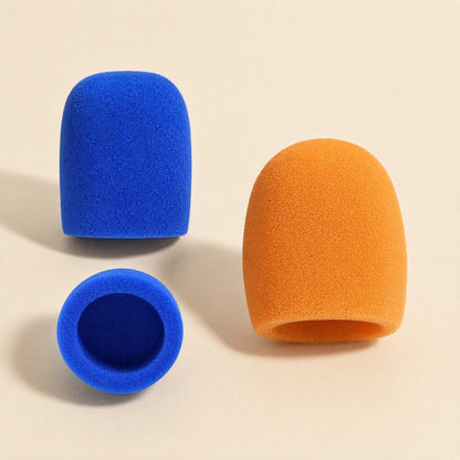 Spongehush – Blue and orange foam mic covers, with a blue cover lying on its side showing the hollow interior