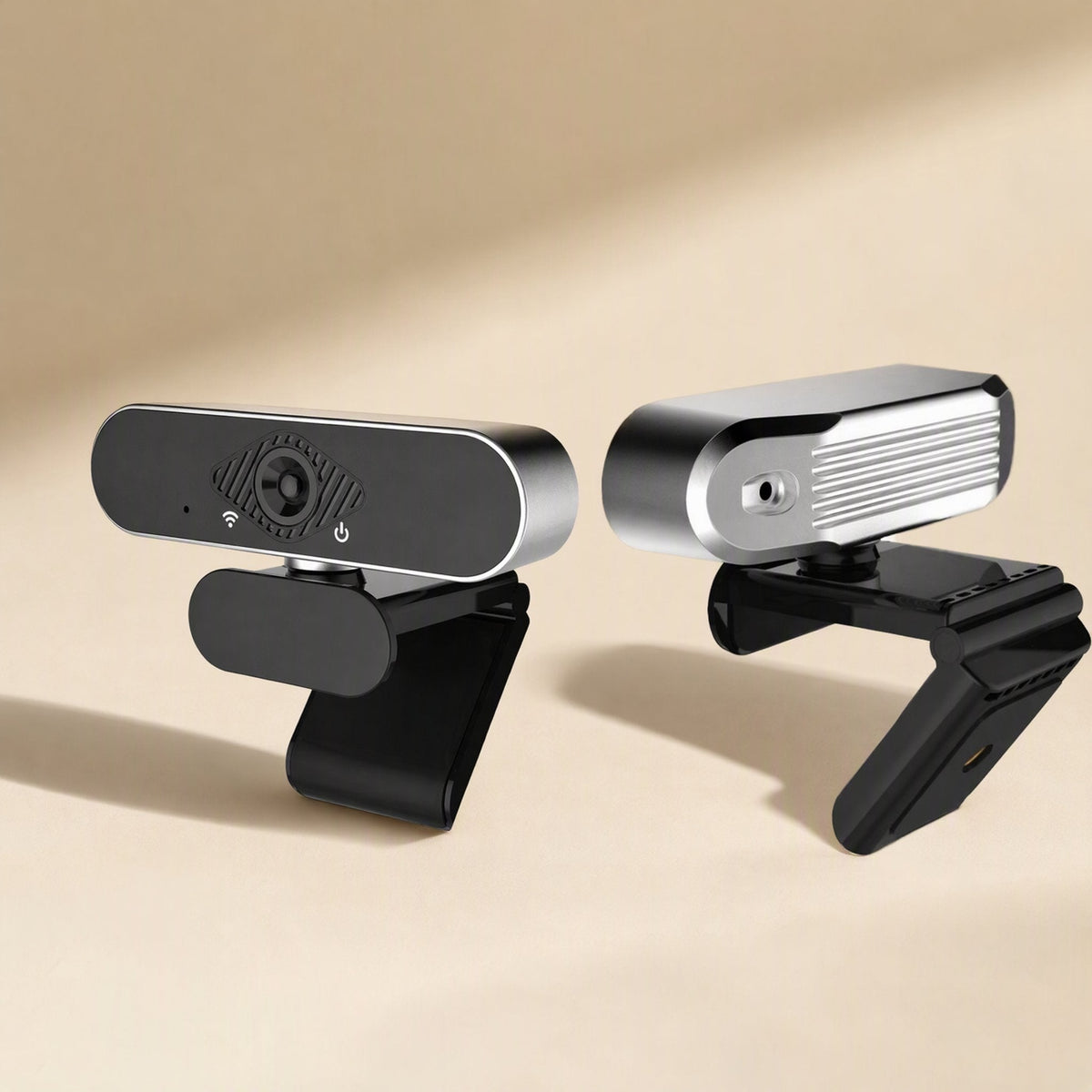 Pixelgleam – Front and rear views of the webcam side by side, showing the ribbed silver back and hinged clip base