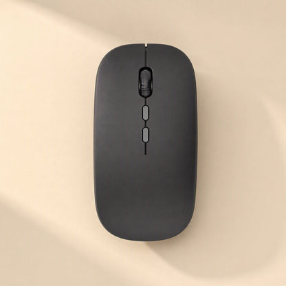 Swiftroam – Black wireless mouse seen from above with scroll wheel and two side buttons on a beige surface