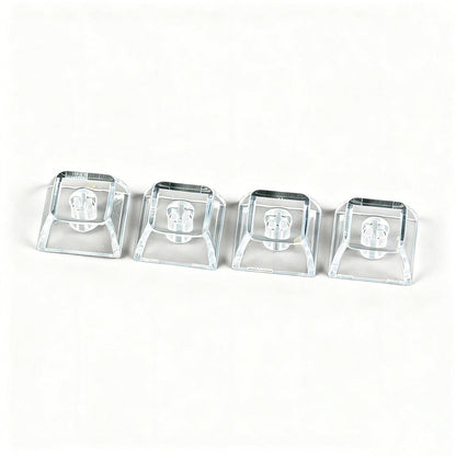 Clearcap – Four clear keycaps lined up in a row on a white background, shown from a slightly raised front angle