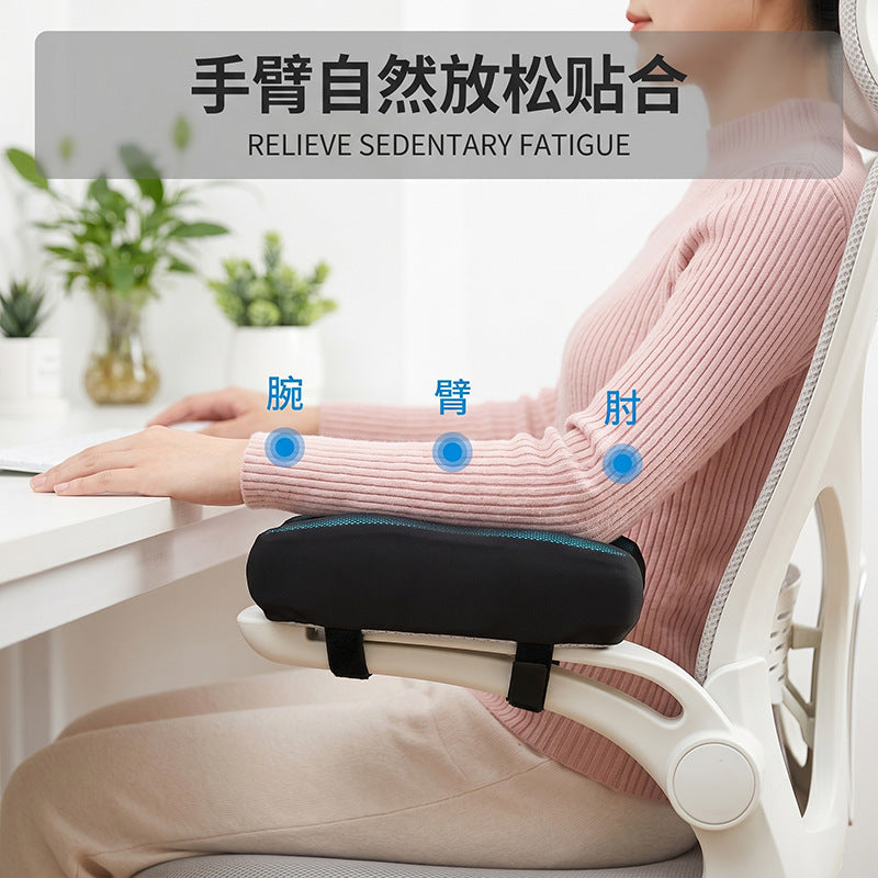 Perchmellow – Woman in a pink sweater typing at a desk with her forearm resting on the armrest pad, with wrist, arm, elbow