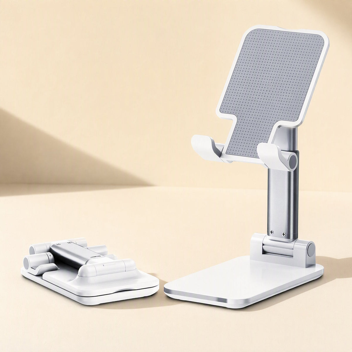 Flexperch Phone Stand – white folding desk phone stand upright next to a second one folded flat, on a cream surface
