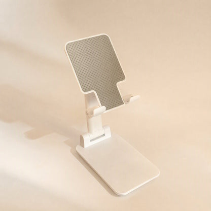 Flipangle – White foldable desktop stand fully extended with raised arm and angled grey textured rest