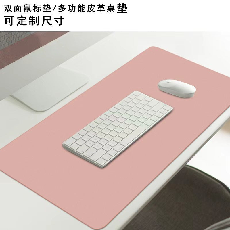 Deskloom Gaming Desk Mat in pink on a white desk under a white keyboard and wireless mouse