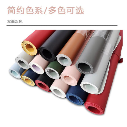 Deskloom Gaming Desk Mat – rolled desk mats in many colours, each showing a different colour on the inner side