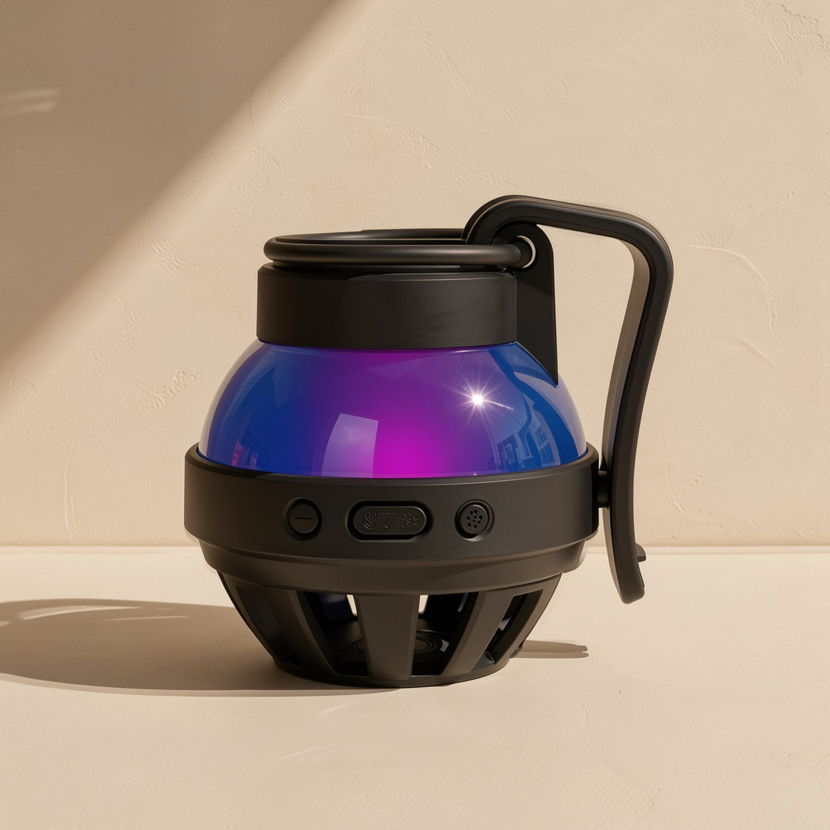 Cardchime speaker in black with front control buttons and a vented base, purple-blue dome