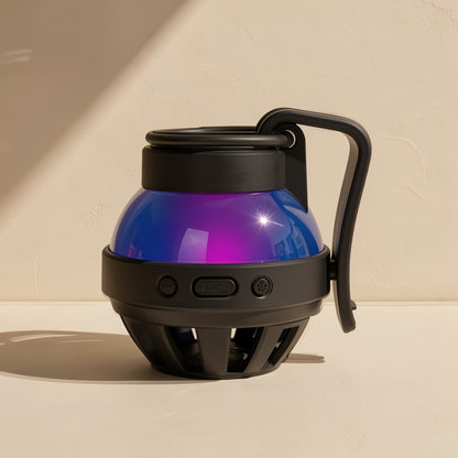 Cardchime speaker in black with front control buttons and a vented base, purple-blue dome