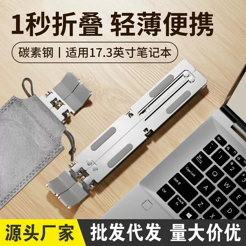 Risehinge – Folded silver stand beside a gray drawstring pouch on a wooden desk next to a laptop keyboard