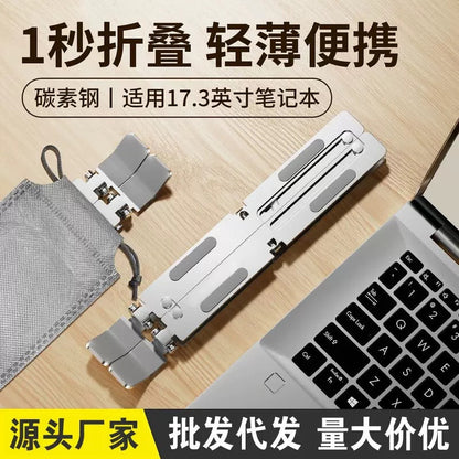Risehinge – Folded silver stand beside a gray drawstring pouch on a wooden desk next to a laptop keyboard