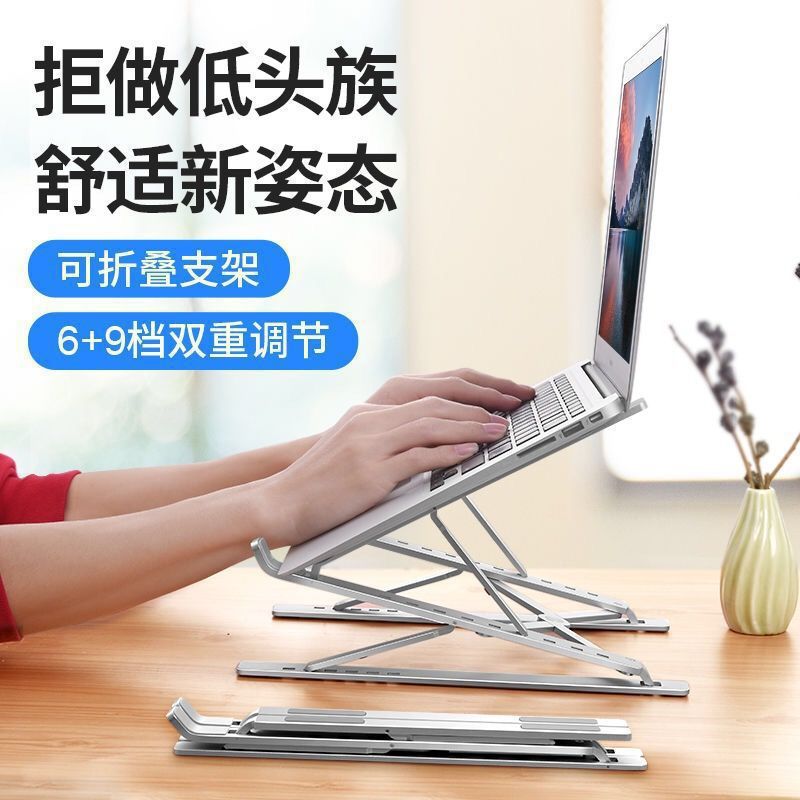 Risehinge – Hands typing on a laptop raised on the silver stand, with a second stand folded flat on the desk