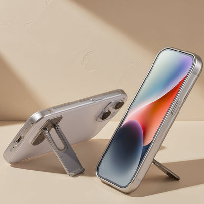 Spinstand – Silver stand unfolded on the back of a phone lying flat, beside a second phone standing upright, screen facing