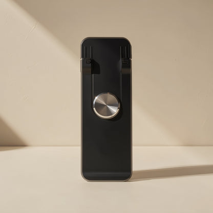 Spinstand – Close-up of the stand folded flat, showing the black body and brushed metal disc in the centre