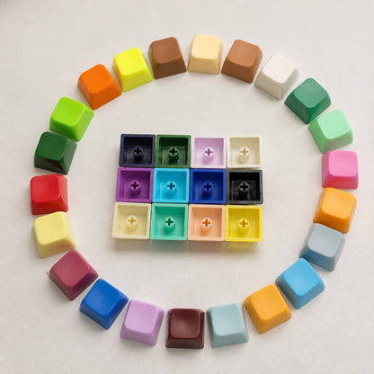 Capscript – Circle of colourful keycaps around twelve upturned caps showing cross-shaped stem mounts underneath
