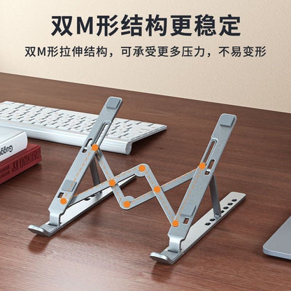 Tiltfolio – Silver laptop stand on a wooden desk beside a keyboard, with orange dots marking its double-M support frame