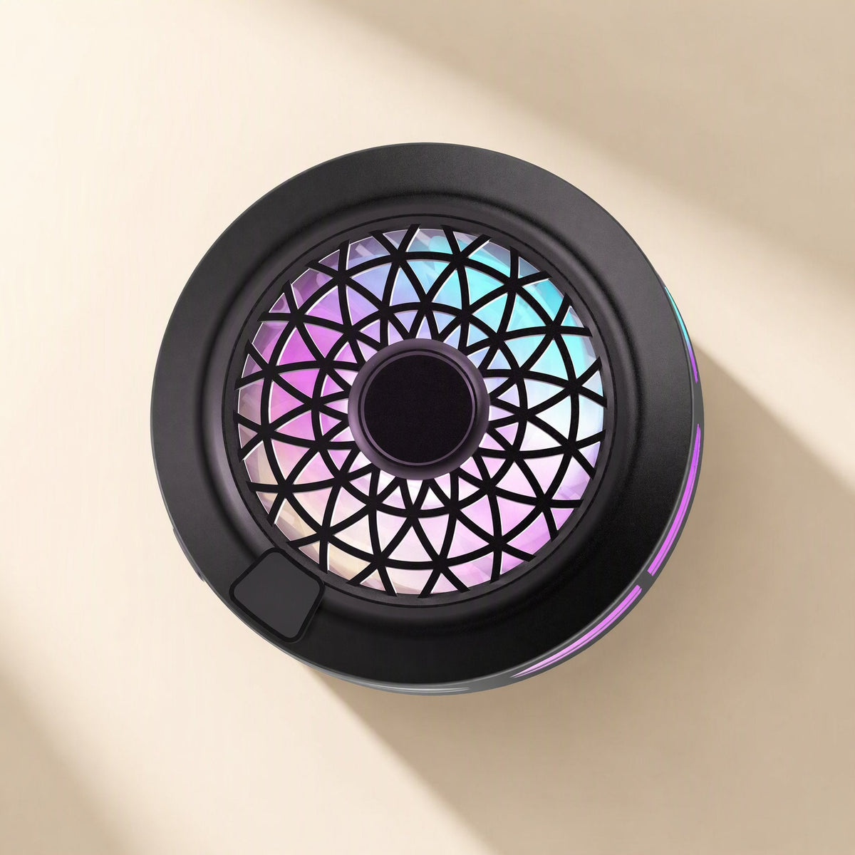 Typechill – Top-down view of the black round cooler with a geometric grille, pink and teal glow and a side button