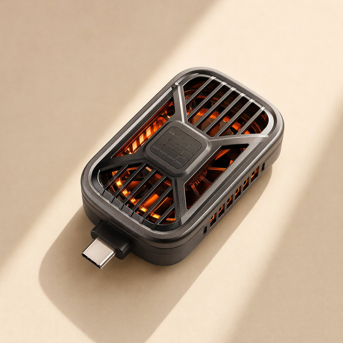 Typechill – Rectangular cooler with a Type-C connector, an X-shaped grille and orange light glowing through the fan