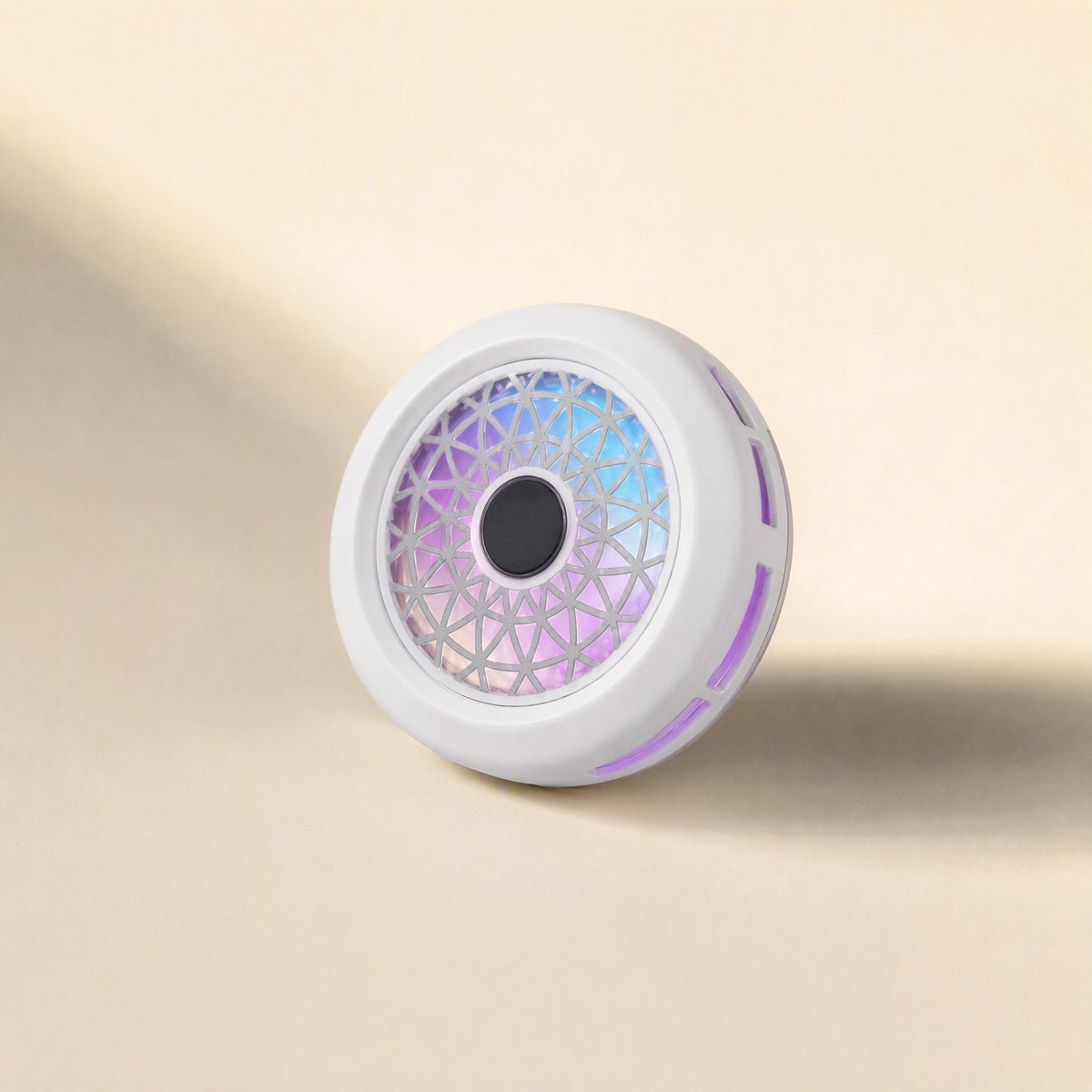 Typechill Mobile Phone Cooler – white round cooler angled to show the lit grille, centre disc and purple glowing side vents