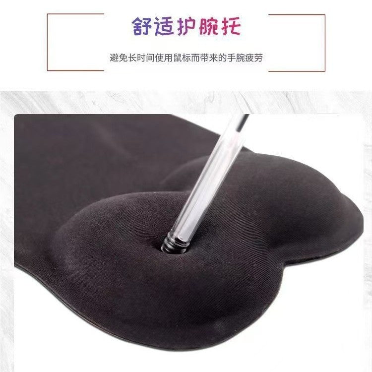 Toonwrist – Close-up of black wrist rest pad with a pen pressing into the soft cushioned gel surface