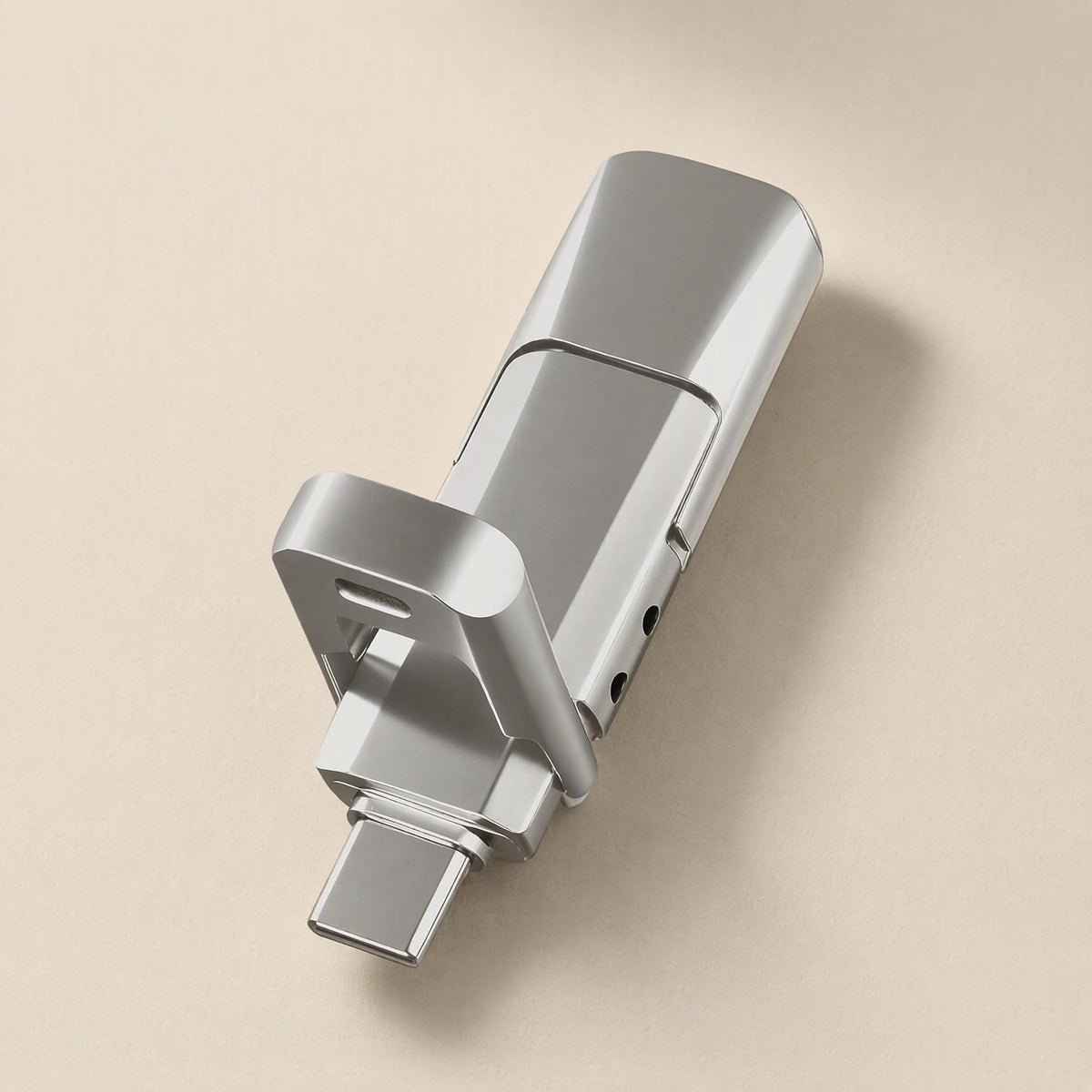 Pivotflash – Top-down view of a silver metal flash drive with the USB-C plug extended and the pivot frame lifted
