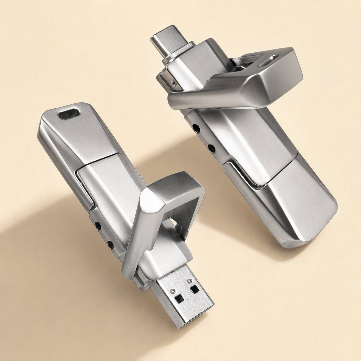 Pivotflash – Two silver metal flash drives side by side, one showing a USB-A plug and one showing a USB-C plug