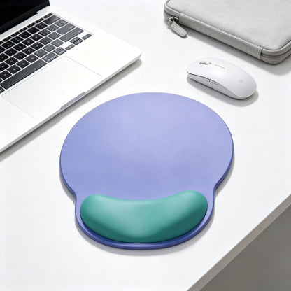 Dualhue – Purple mouse pad with green wrist rest on a white desk beside a laptop, wireless mouse and gray sleeve