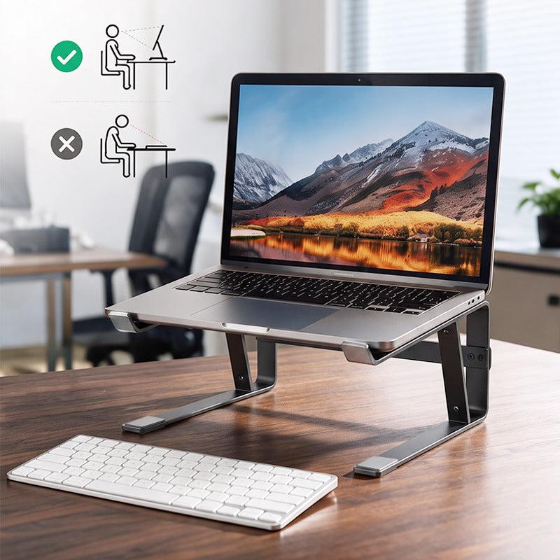 Loftvent – Dark metal laptop stand raising a laptop screen on a wood desk, with a wireless keyboard below and posture diagram