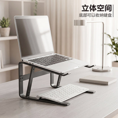Loftvent – Side view of the stand with a laptop on top and a keyboard tucked in the space underneath, on a light desk
