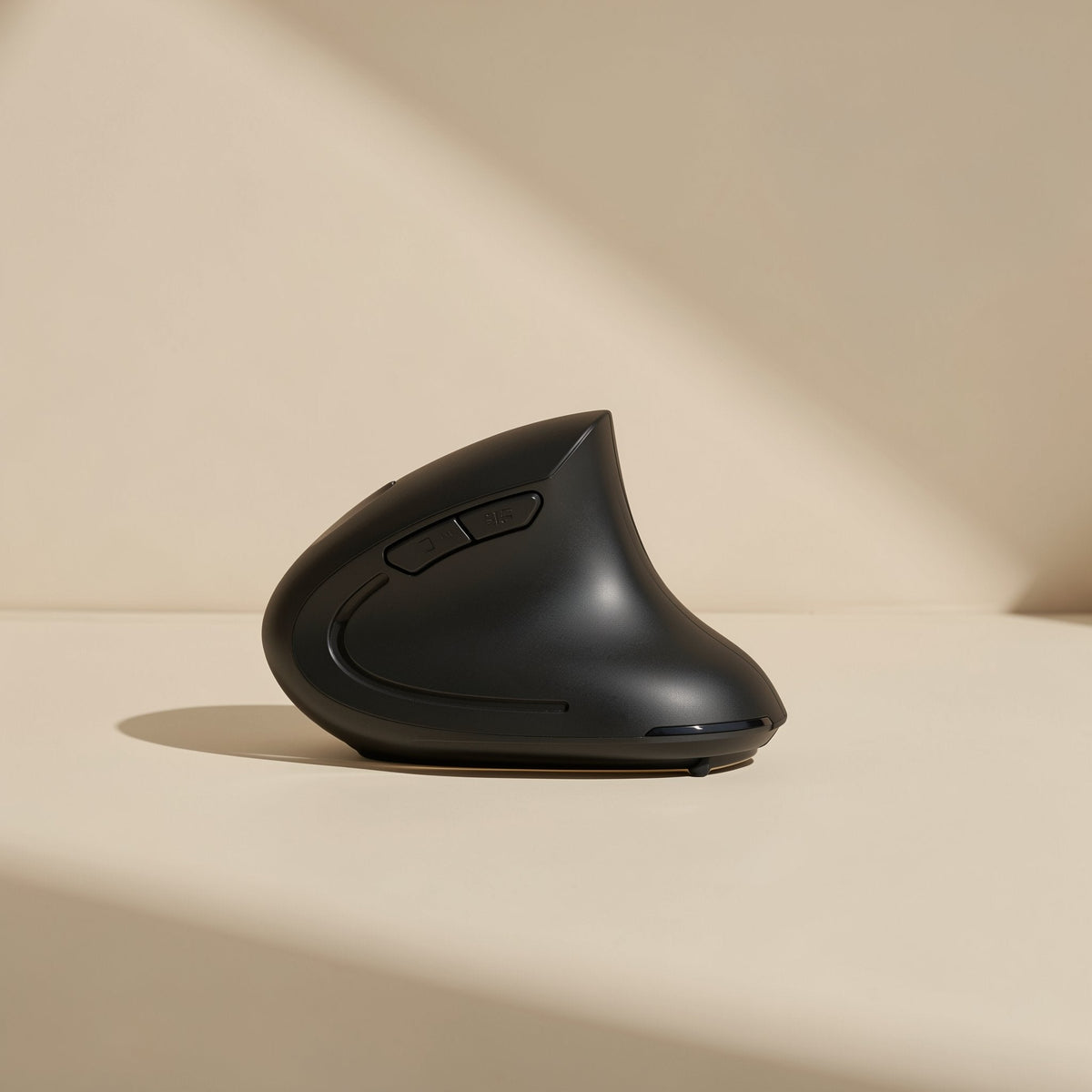 Palmglide – Rear three-quarter view of the black vertical mouse showing side buttons and thumb curve in soft light