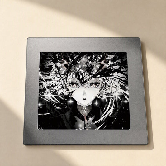 Glassslide – Underside of the glass mouse pad showing a gray metal base with a framed anime print on a beige surface