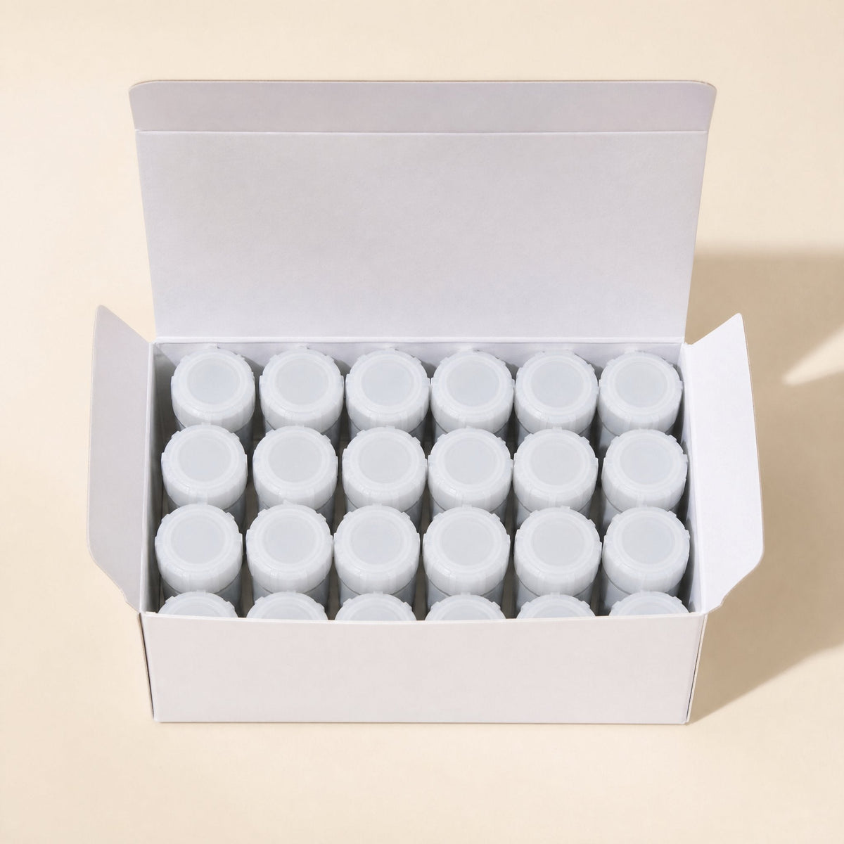Thermabond 10g CPU Thermal Paste – open white box holding rows of the small white-capped jars, seen from above
