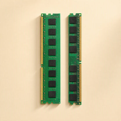 Bitboost – Two green RAM modules standing upright, showing eight black memory chips and gold contacts