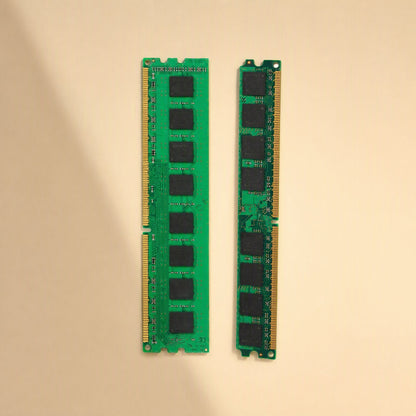 Bitboost DDR3 1333 Desktop Memory – pair of green memory sticks viewed from above with a soft diagonal shadow on beige