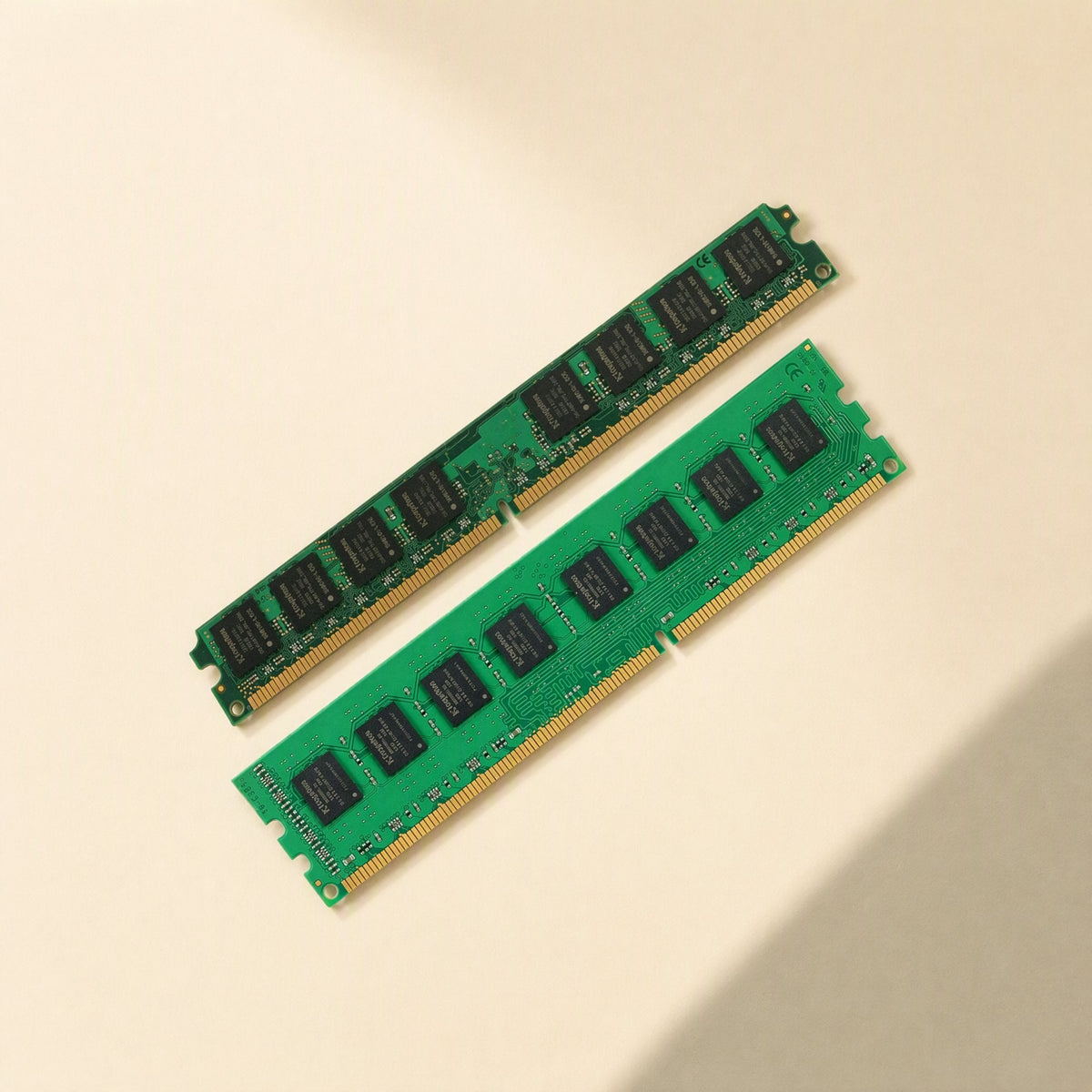 Bitboost DDR3 1333 Desktop Memory – two RAM modules laid diagonally, one showing chips and gold edge connector pins