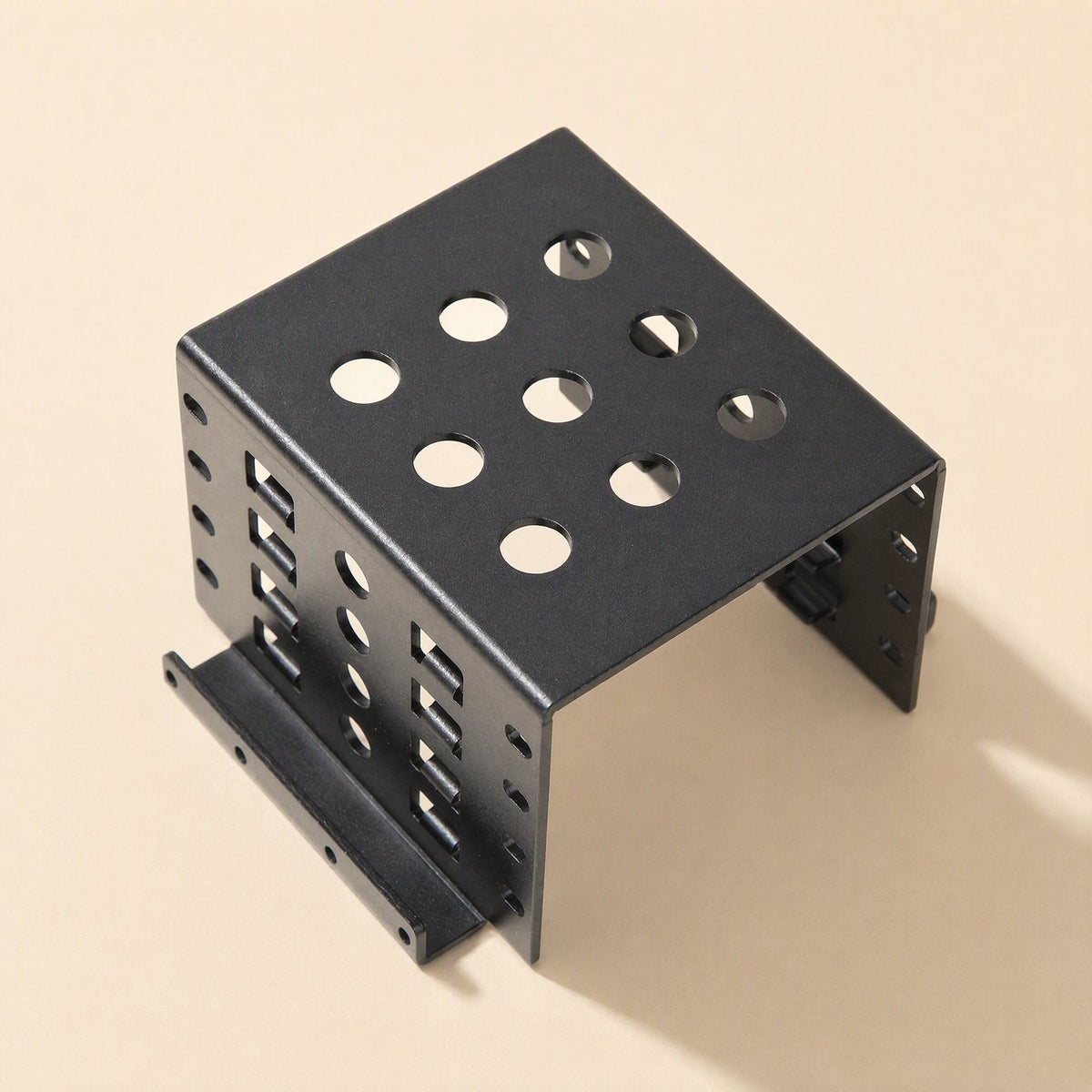 Alloyhold – Black bracket with slotted side panels and a mounting flange, shown from a slightly different top-down angle