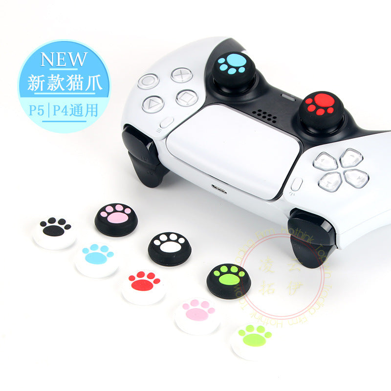 Pawgrip silicone cat claw controller caps in six paw colours beside a white PS5 controller with red and blue caps