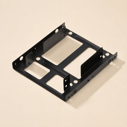 Drivehold – Black metal 2.5 to 3.5 inch bracket seen from a low angle, with two drive slots and side screw holes