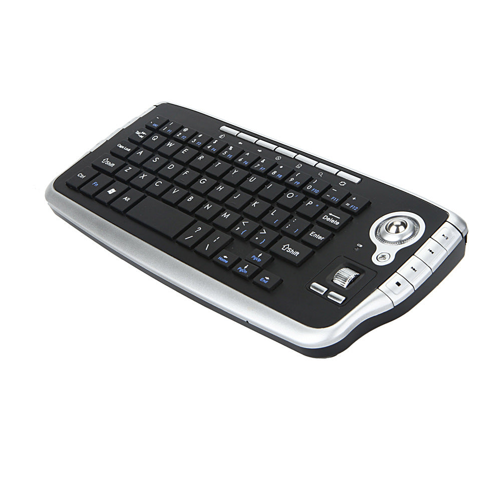 Keytrail – Black and silver mini keyboard with trackball and scroll wheel, seen from the right at an angle