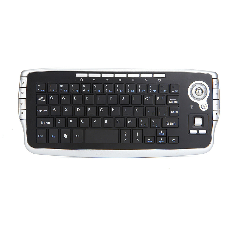 Keytrail – Top-down view of the black keyboard with trackball, mouse buttons and silver side buttons on a white background