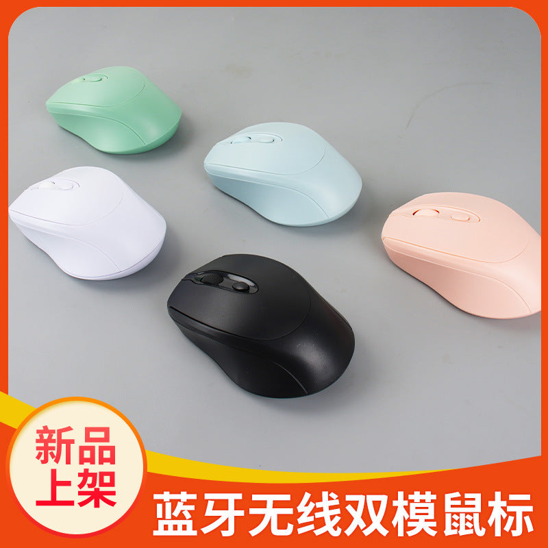 Duorove Dual Mode Wireless Mouse in mint green, light blue, white, pink and black on a grey surface