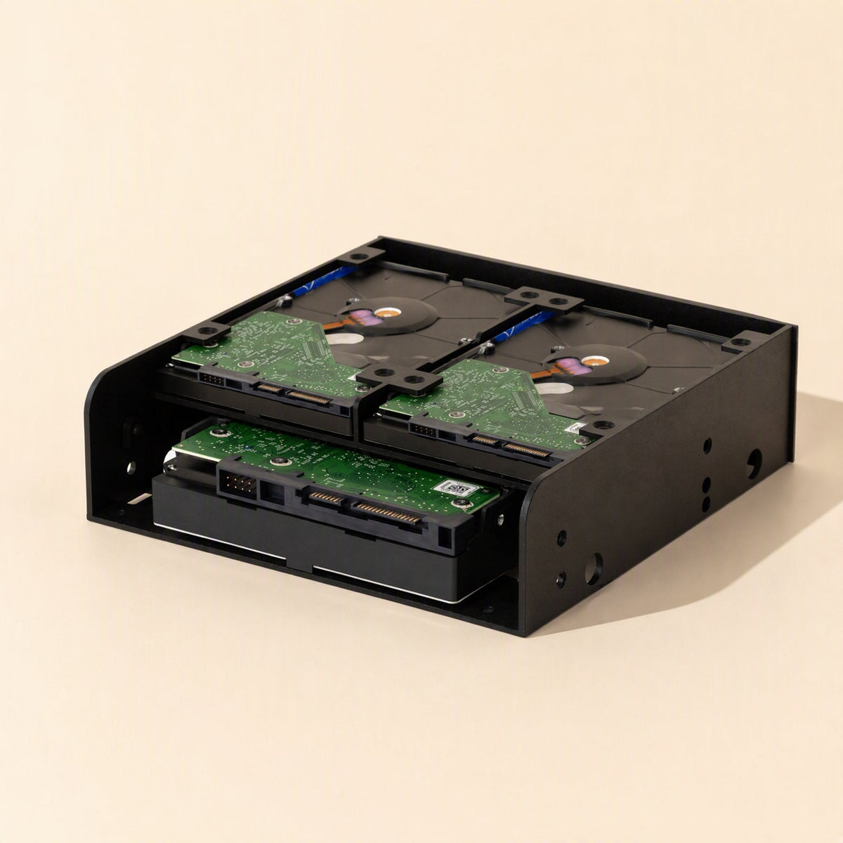 Baybridge – Black bracket with two hard drives on top and a third drive slotted in below, seen from the front corner