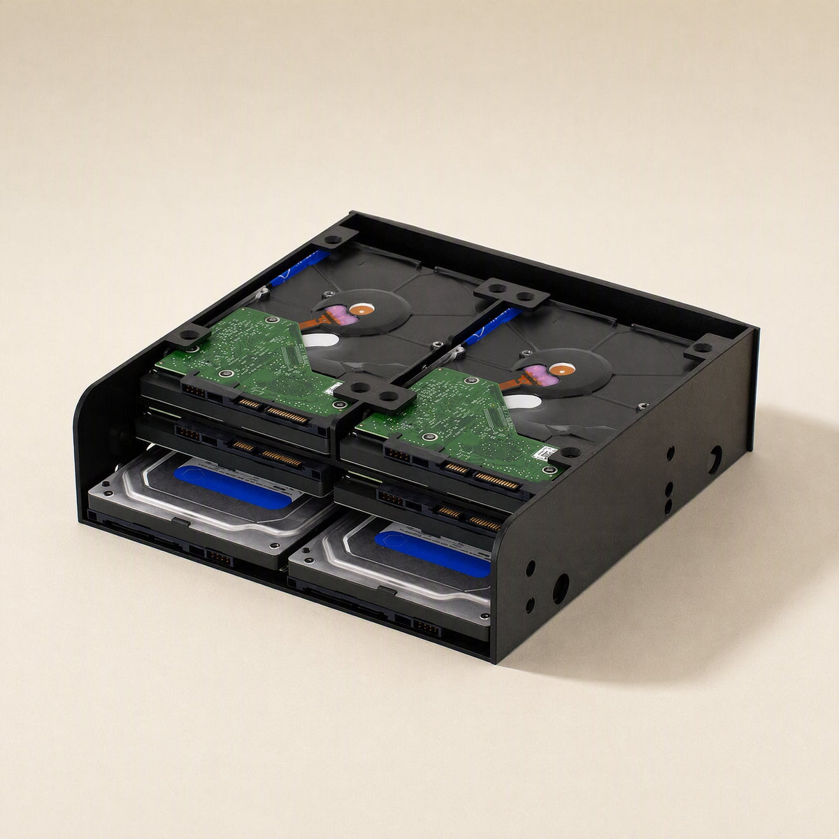 Baybridge – Bracket loaded with four 3.5-inch hard drives in two stacked rows, green circuit boards facing out