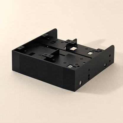 Baybridge – Empty black metal bracket from above, showing mounting tabs, screw holes and cutouts, no drives installed