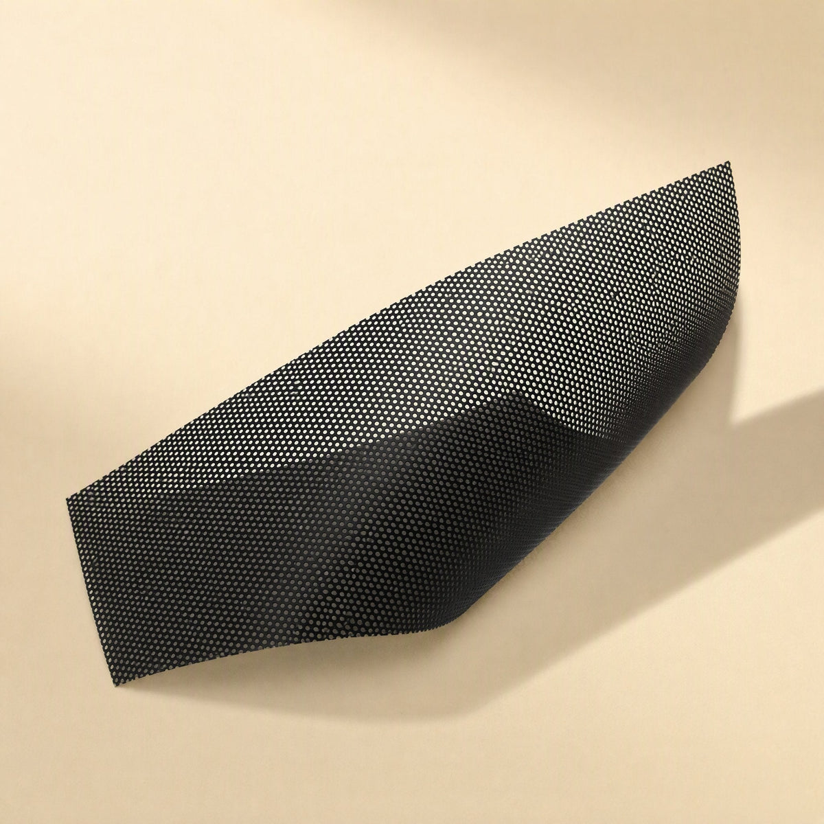 Fanfilter PVC Chassis Fan Dust Filter Mesh – close-up of a curved black mesh sheet showing the fine perforated hole pattern
