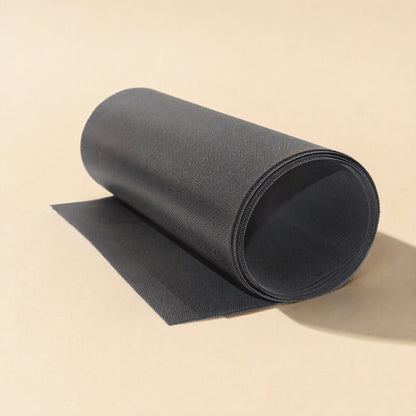 Fanfilter – Black mesh roll with unrolled end, shown in a darker grey tone with a visible woven texture