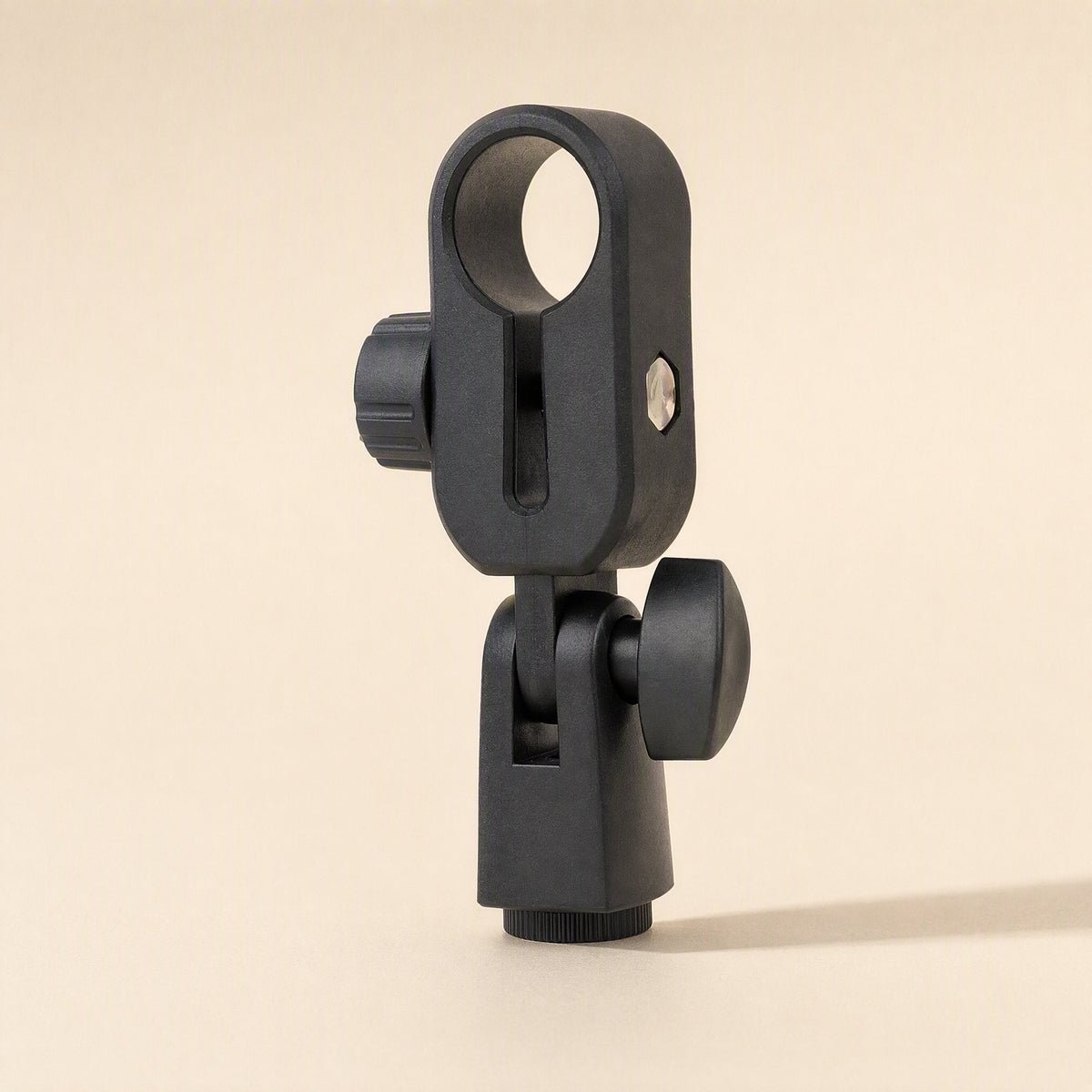 Shockbrace – Black plastic microphone clip holder with a tilting joint and side knob, angled view
