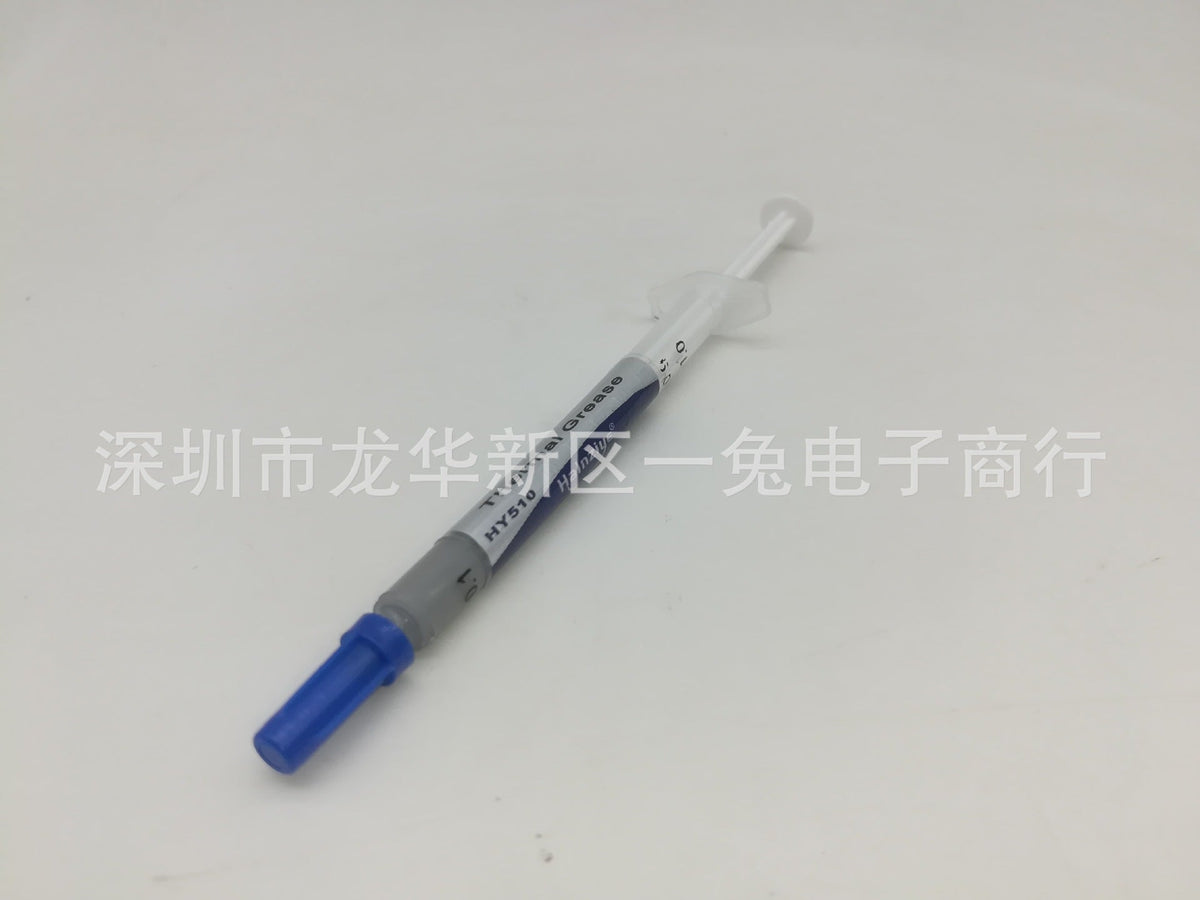 Thermend – Syringe of thermal paste angled with blue cap at lower left, label text partly visible, plain white background