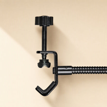 Popmesh – Close-up of the black screw clamp and knob at the end of the gooseneck arm on a beige background